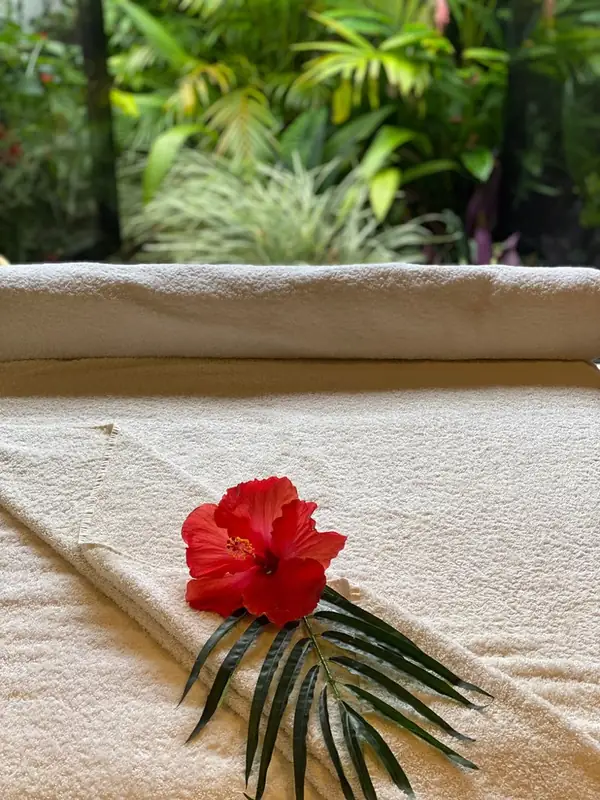 A massage table made up with fresh towels